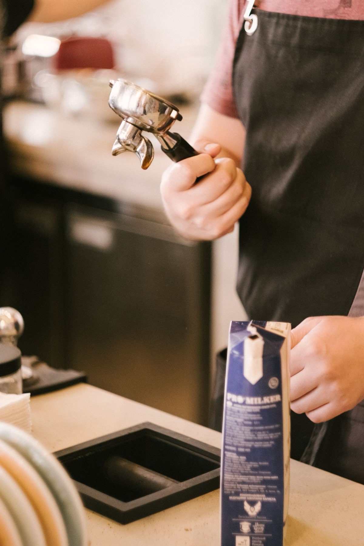 Barista preparing coffee at an espresso machine