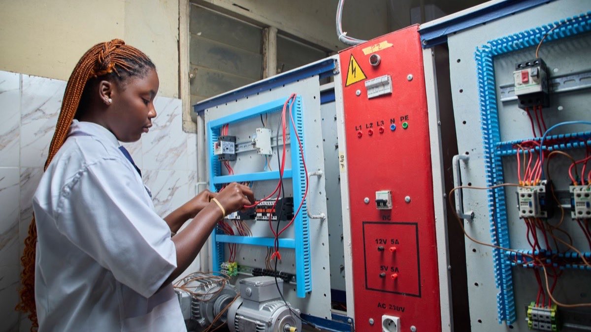 Licensed electrician working on a commercial electrical panel