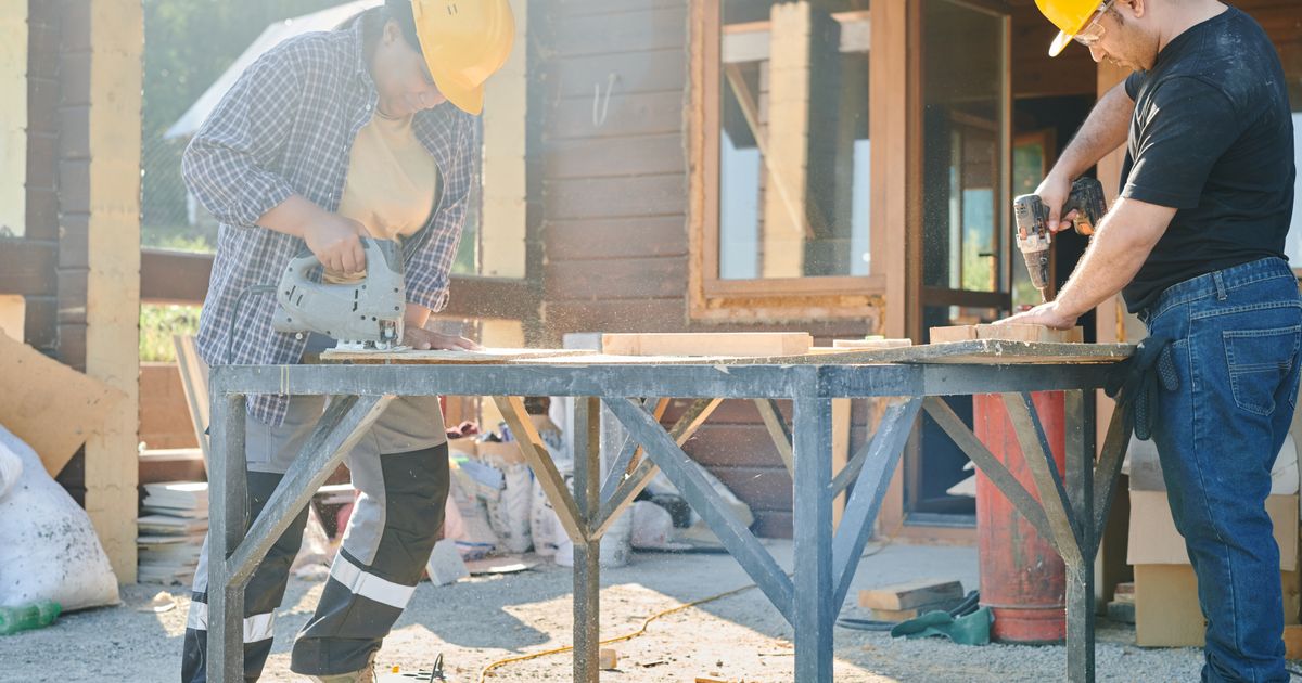 Skilled trades workers building on a construction site