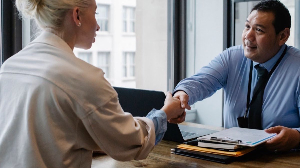 Job candidate and interviewer having a focused conversation during a job interview