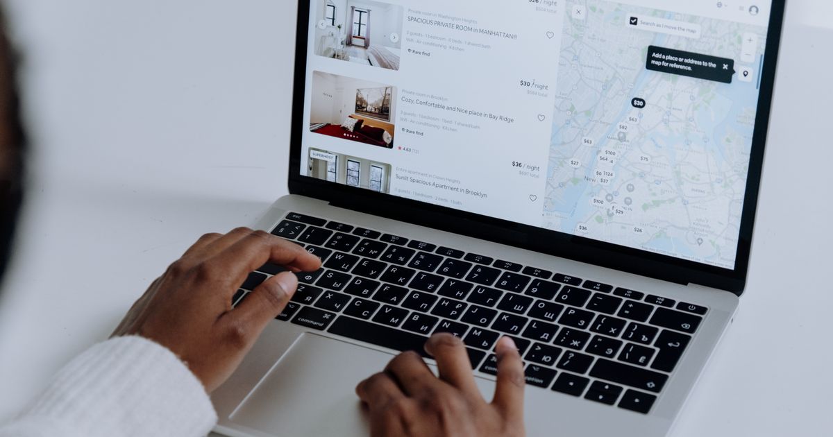 Job seeker browsing roles on a laptop