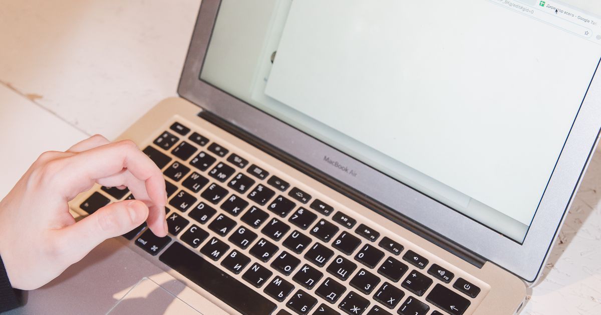 Hands typing a LinkedIn headline on a laptop