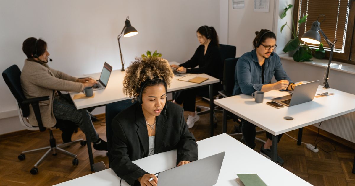 Professionals working steadily in a busy office