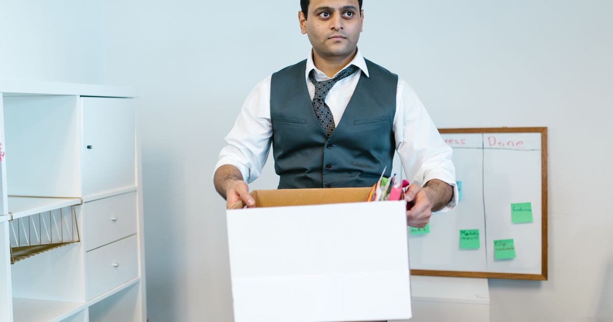 Professional writing a resignation letter at a desk