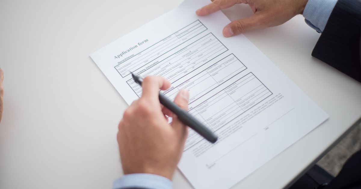 Employee handing a two weeks notice letter to a manager